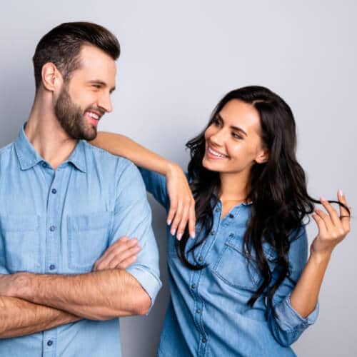 Men and Woman with Healthy Hair Smiling